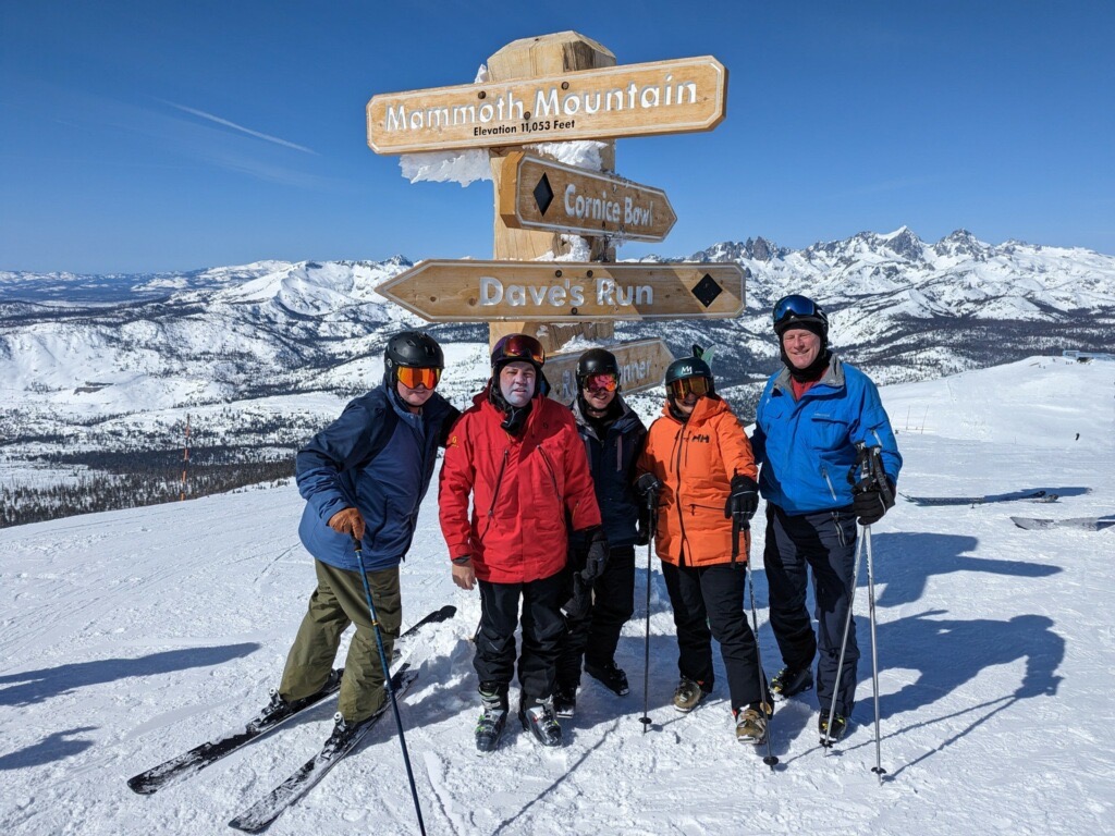 People around top of Mammoth pole